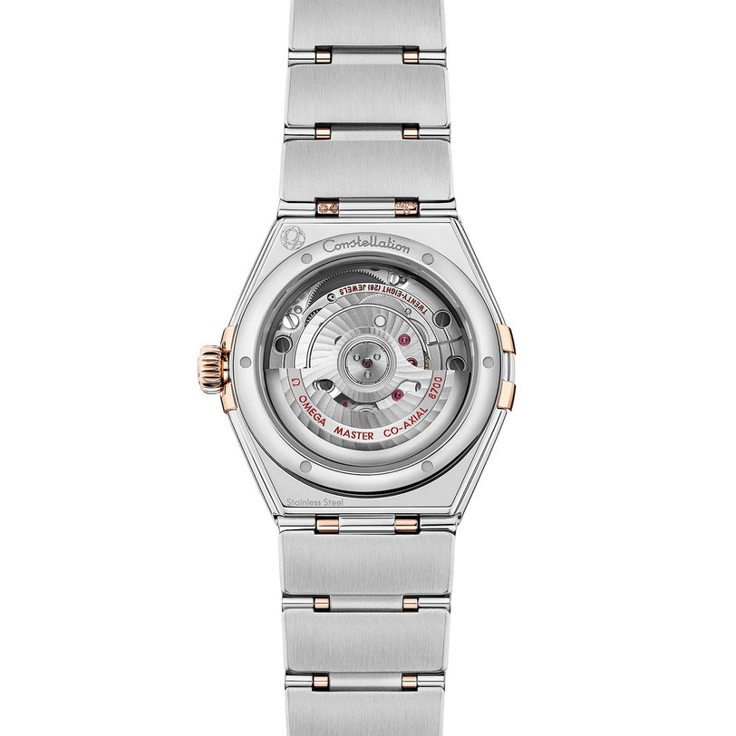 Back view of the OMEGA Constellation watch highlighting its stainless steel and rose gold bracelet and visible mechanical movement through a transparent case back.