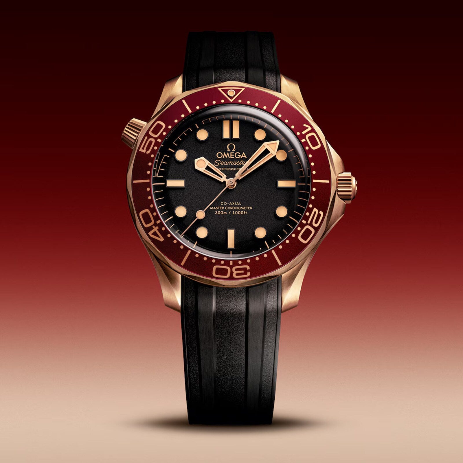 An OMEGA Seamaster Diver 300M wristwatch with a bronze gold case, burgundy bezel, and black rubber strap, featuring the Master Chronometer Calibre 8806, set against a gradient red-to-beige background.