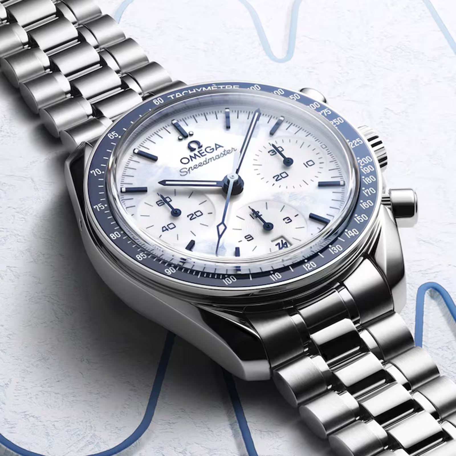 Silver Omega watch with a detailed face on a light background
