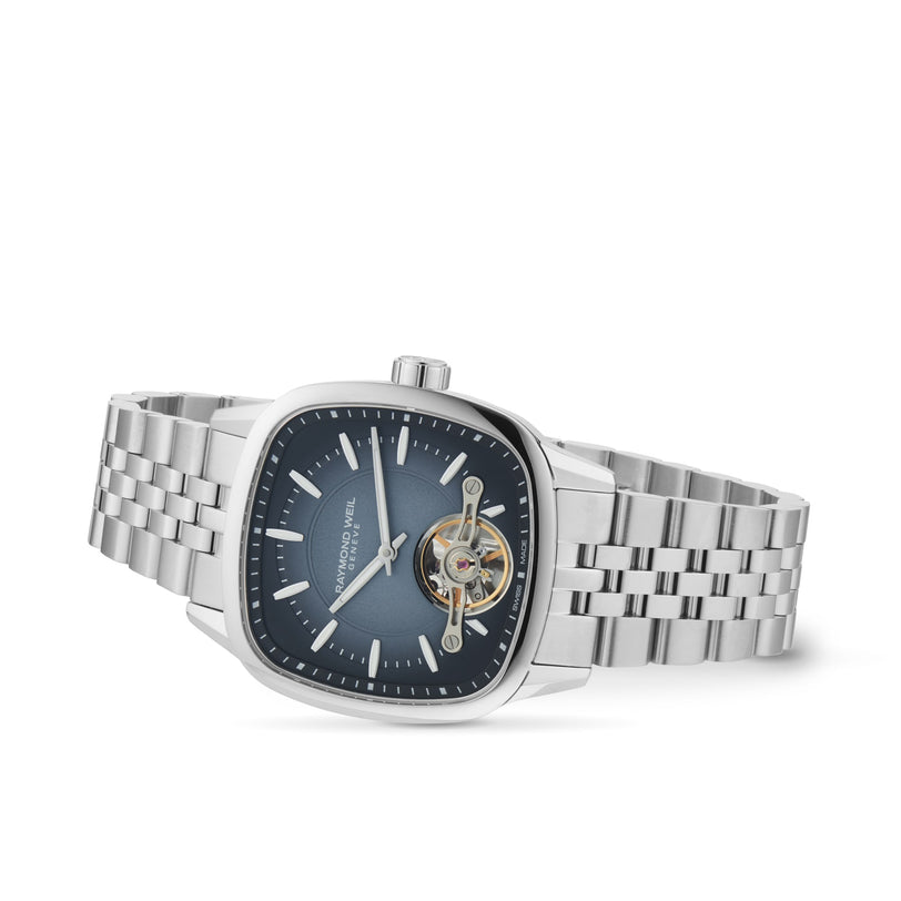 The Raymond Weil Freelancer Calibre RW1212 Automatic features a stainless steel case, blue square dial, silver hour markers, exposed tourbillon mechanism, and metal link bracelet—ideal for highlighting urban style.