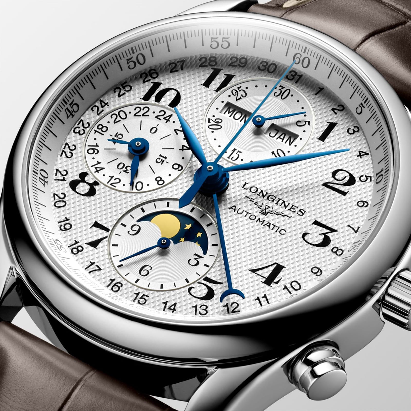 Close-up of the Longines Master Collection Chrono Moonphase, showcasing a stainless steel case, white textured dial with blue hands, subdials for date and moon phase, and a brown leather strap.