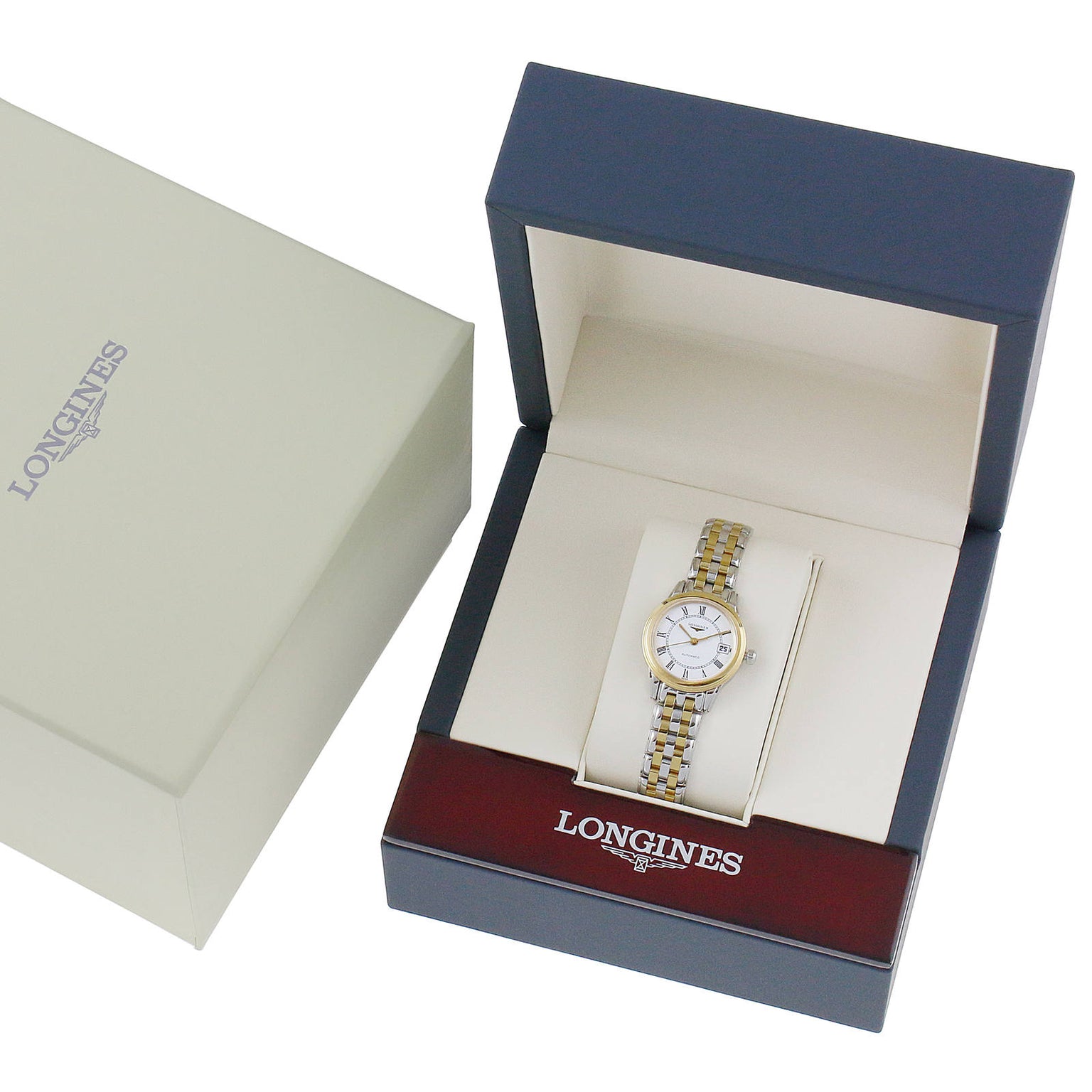 A Longines Flagship wristwatch in a display box, shown alongside its branded outer packaging.