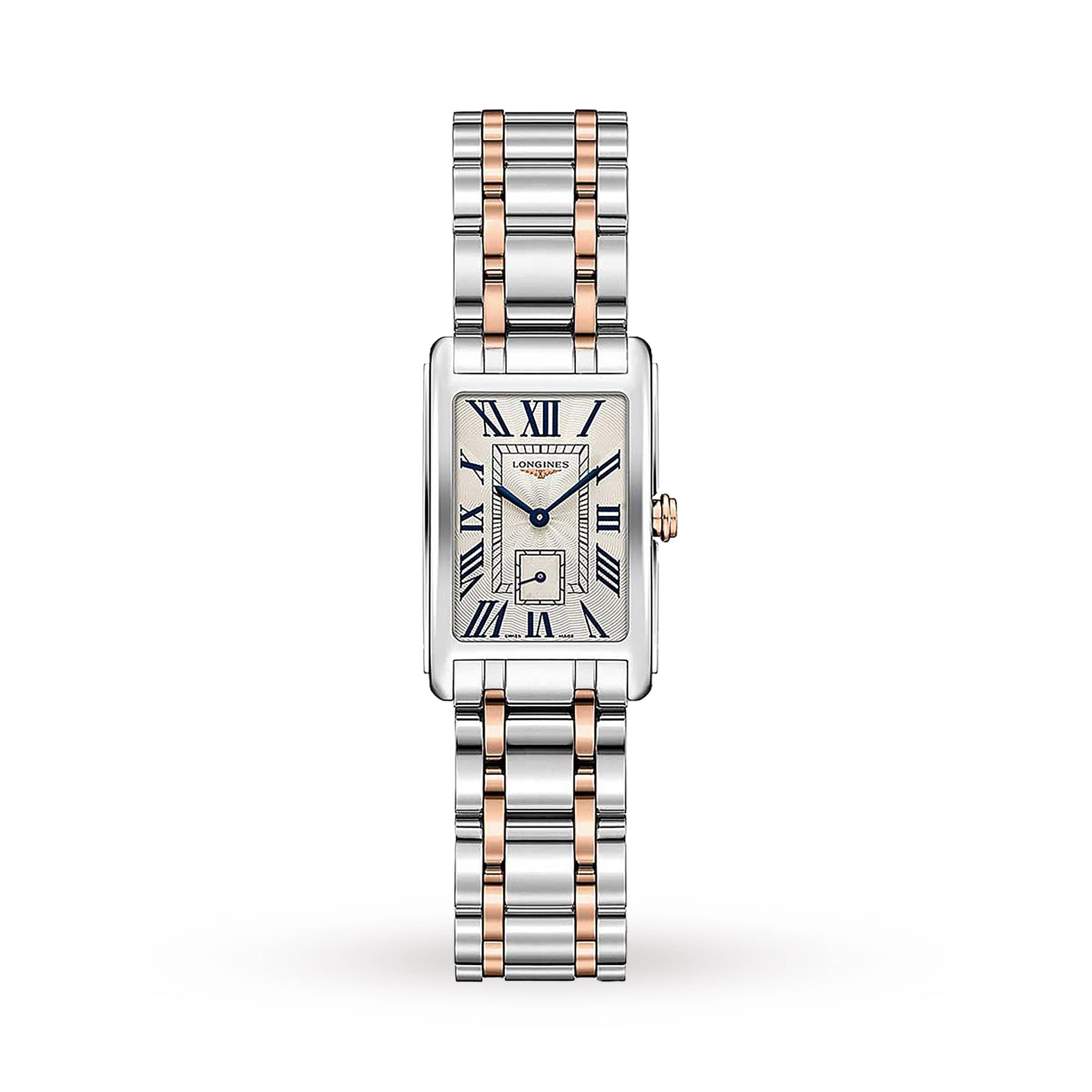 The Longines DolceVita features a rectangular case, metal link bracelet, Roman numeral markers, blue hands, small seconds subdial on a light face, and a precise quartz movement—blending classic elegance and modern grace.