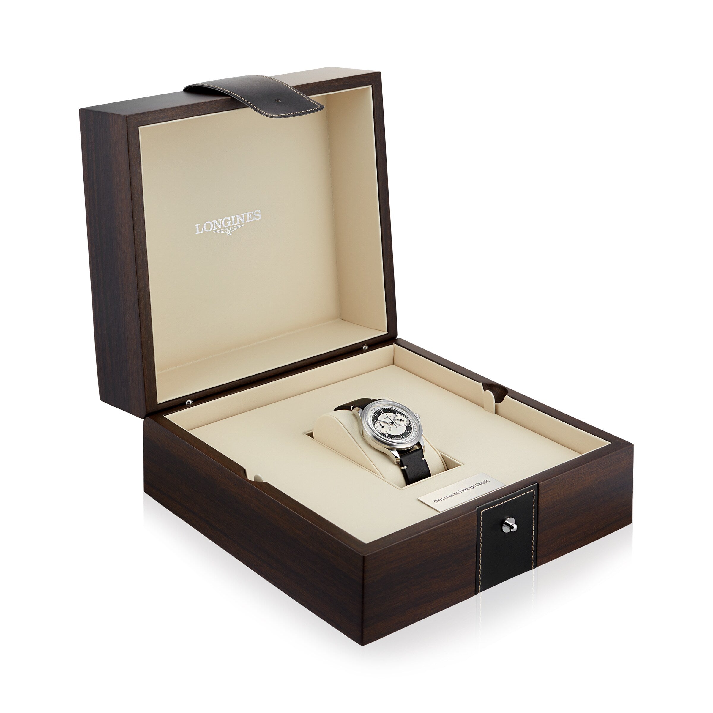 The Longines Tuxedo wristwatch, featuring a black strap and stainless steel case, is showcased inside an open wood-finish Longines watch box with a beige interior.