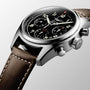 A close-up of the Longines Spirit Chronograph shows a brown leather strap, stainless steel case, black dial with three sub-dials, the Longines logo, and features the precise L688.4 calibre movement.