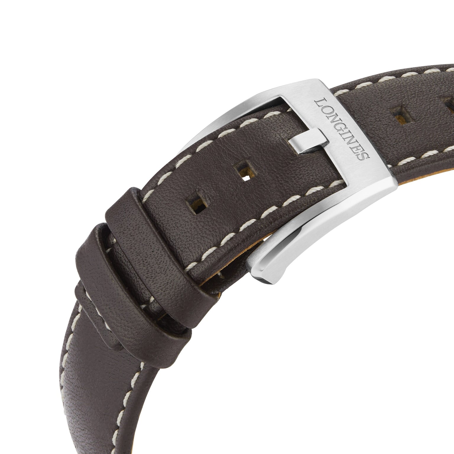 Close-up of a brown leather strap with white stitching and a silver buckle engraved Longines, designed for the Longines Spirit Chronograph.