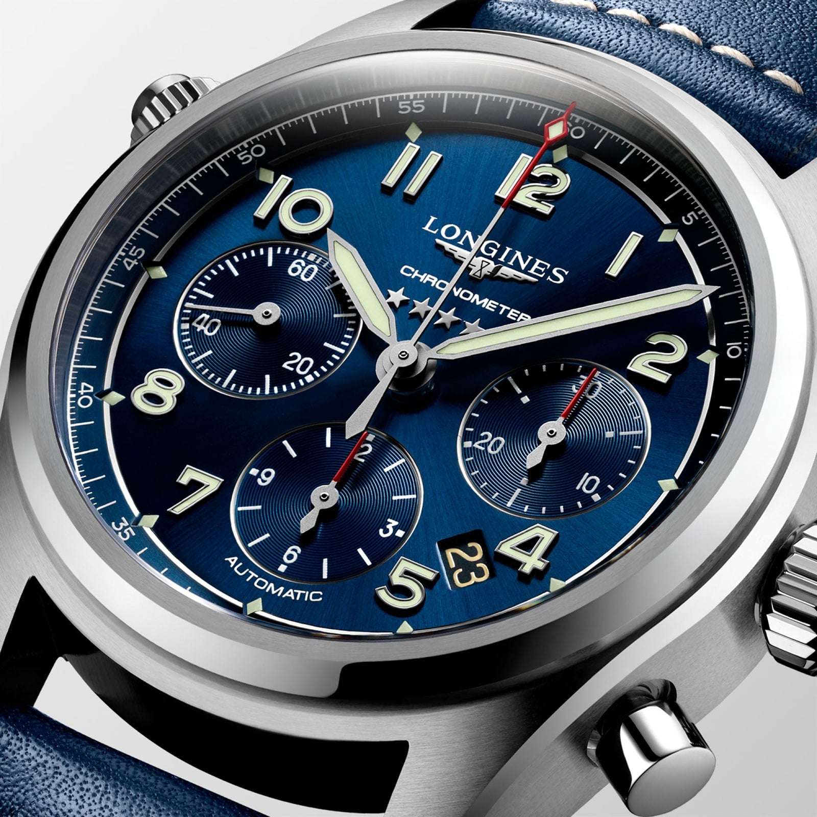 Close-up of the Longines Spirit Chronograph featuring a blue dial, 42mm stainless steel case, three subdials, date display, and a blue leather strap.