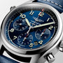 Close-up of the Longines Spirit Chronograph featuring a blue dial, 42mm stainless steel case, three subdials, date display, and a blue leather strap.