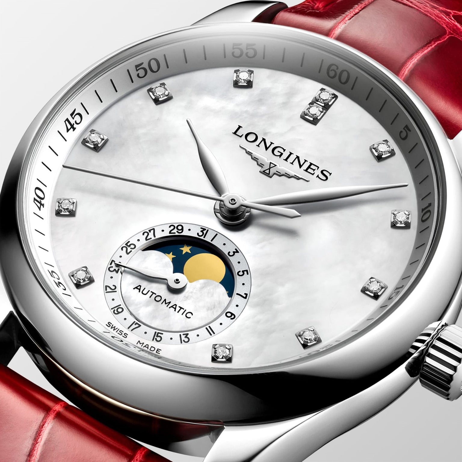 Close-up of the Longines Master Collection Moonphase watch, featuring diamond markers, a moon phase subdial, and a red leather strap.