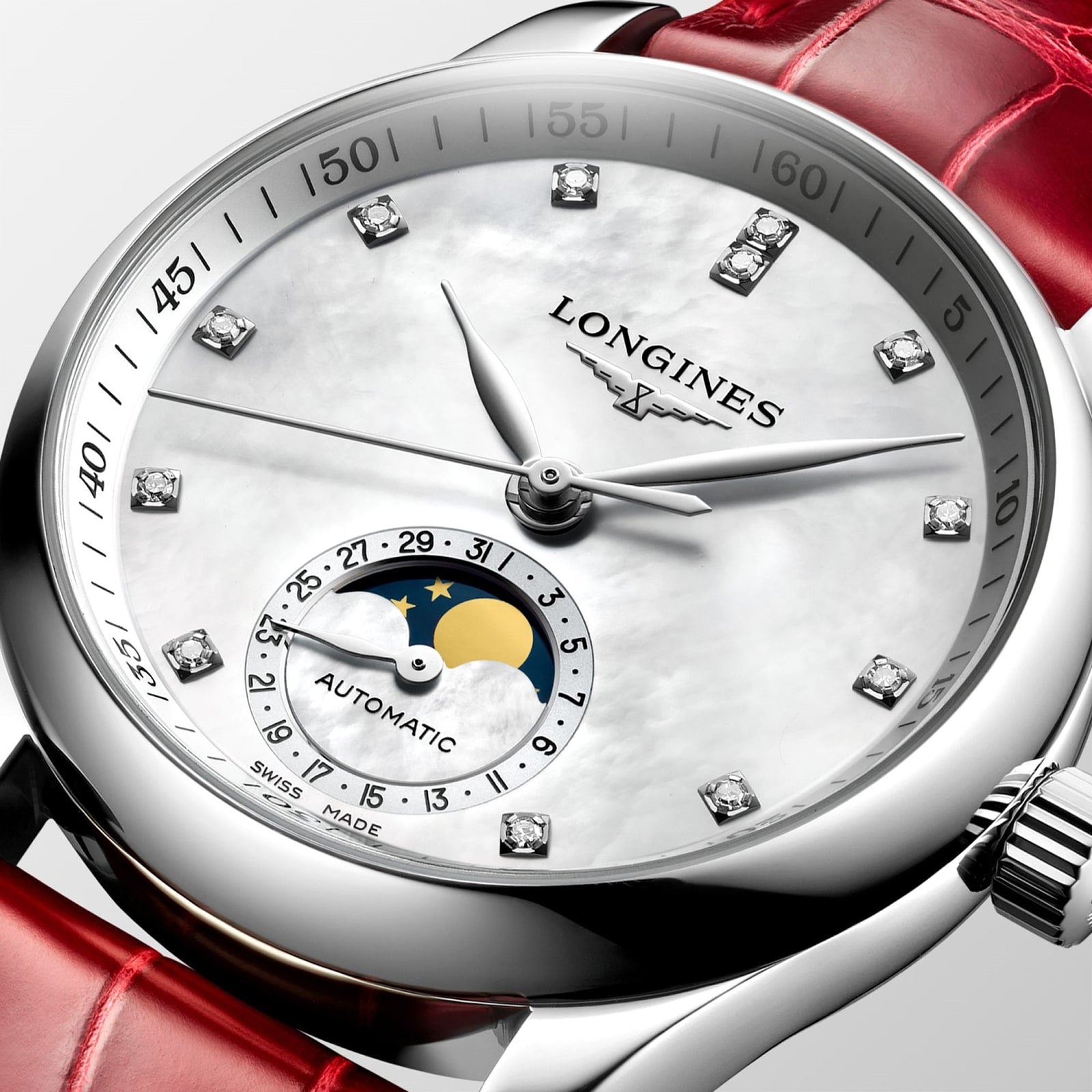 Close-up of the Longines Master Collection Moonphase watch, featuring diamond markers, a moon phase subdial, and a red leather strap.