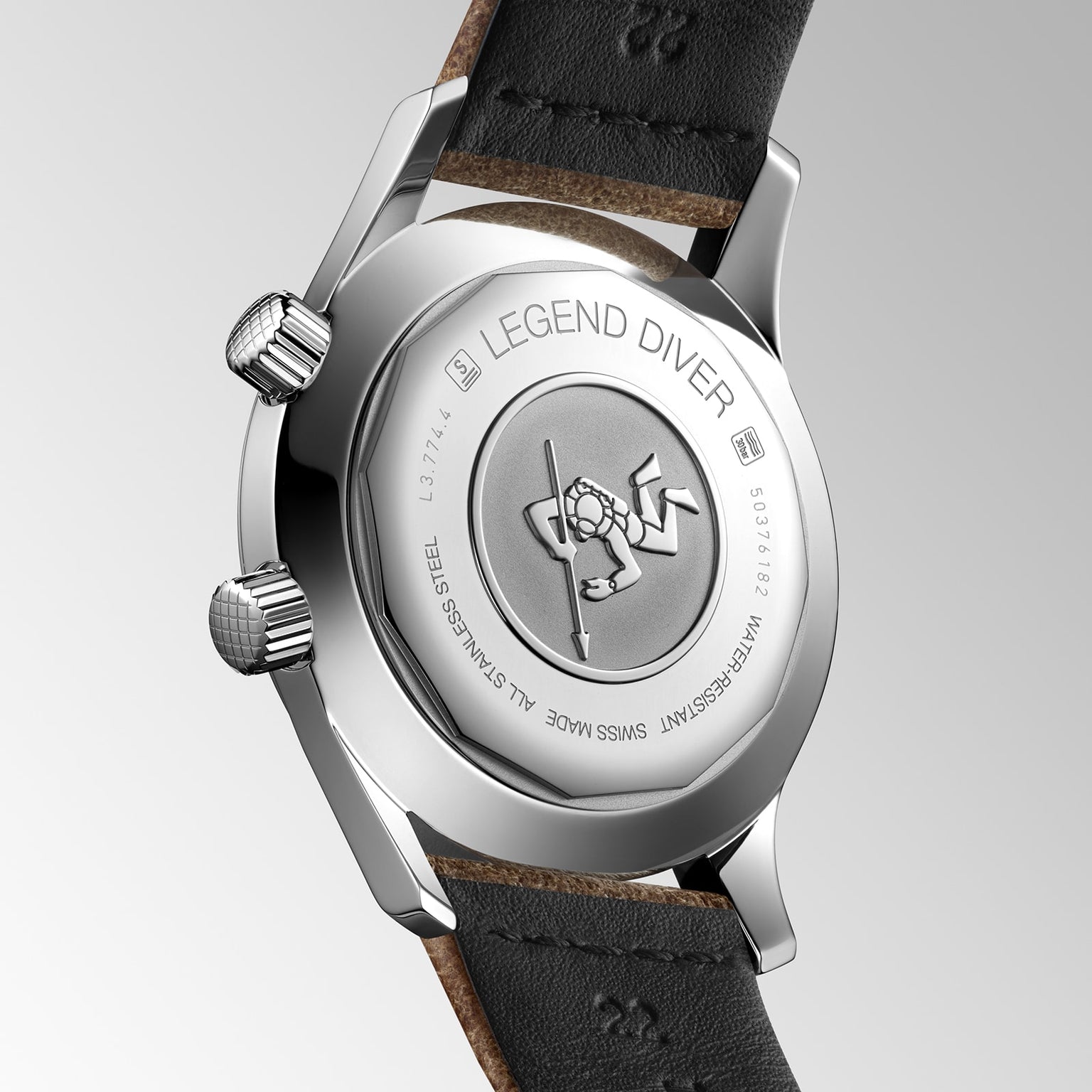 Close-up of the Longines Legend Diver’s stainless steel caseback, featuring an engraved diver logo, black leather strap, and precise L888 calibre movement.