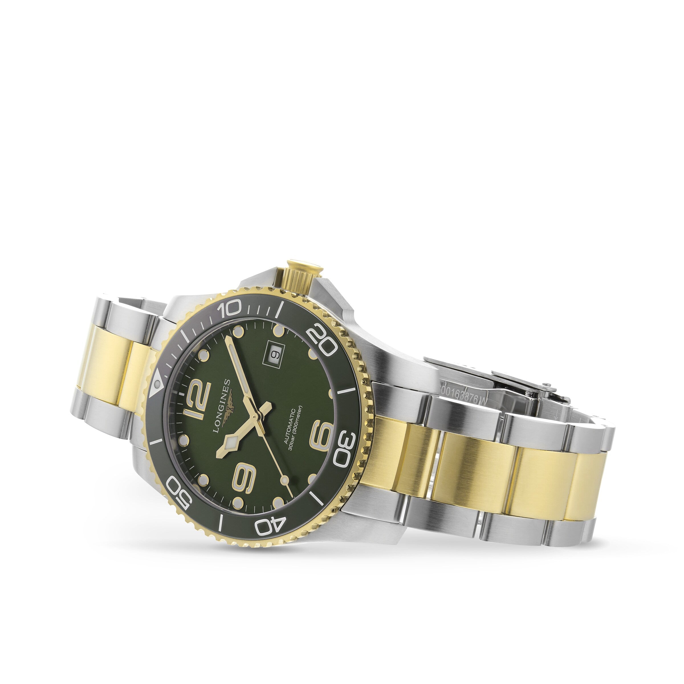 The Longines HydroConquest is a stainless steel and gold diving watch featuring a green dial, rotating bezel, and date display, shown at an angle to highlight both the bracelet and the watch face.