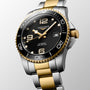 The Longines HydroConquest automatic watch features a black dial, gold bezel, two-tone silver and gold bracelet, date at 3 o’clock, and high water resistance.