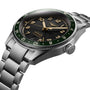 A close-up of the 42mm Longines Spirit Zulu Time, showcasing its stainless steel case, green bezel, anthracite dial with gold-tone hour markers, and a metal bracelet.