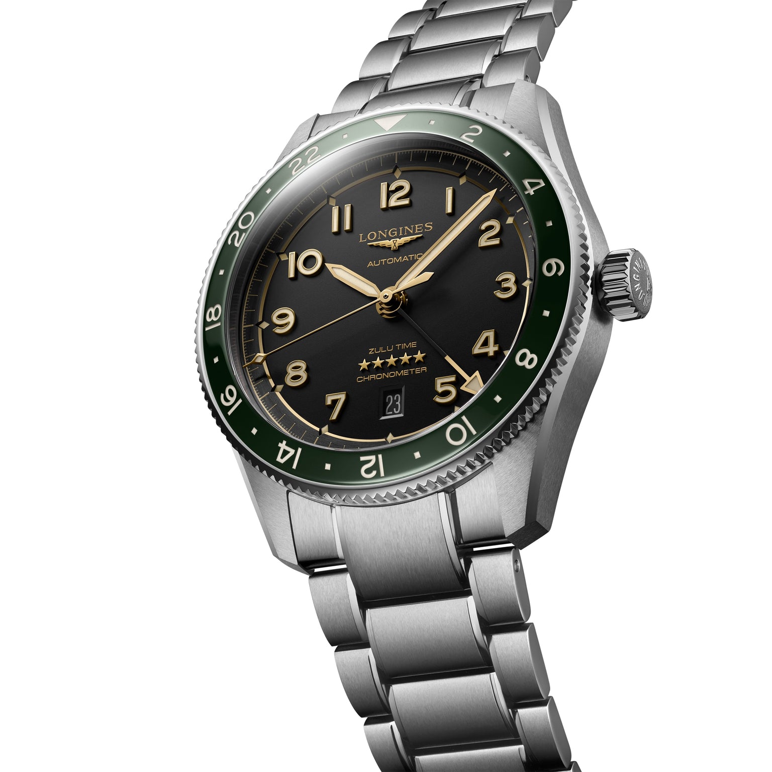 The Longines Spirit Zulu Time, a 42mm stainless steel wristwatch with anthracite dial, green bezel, gold markers, and silver bracelet, is shown at an angle.