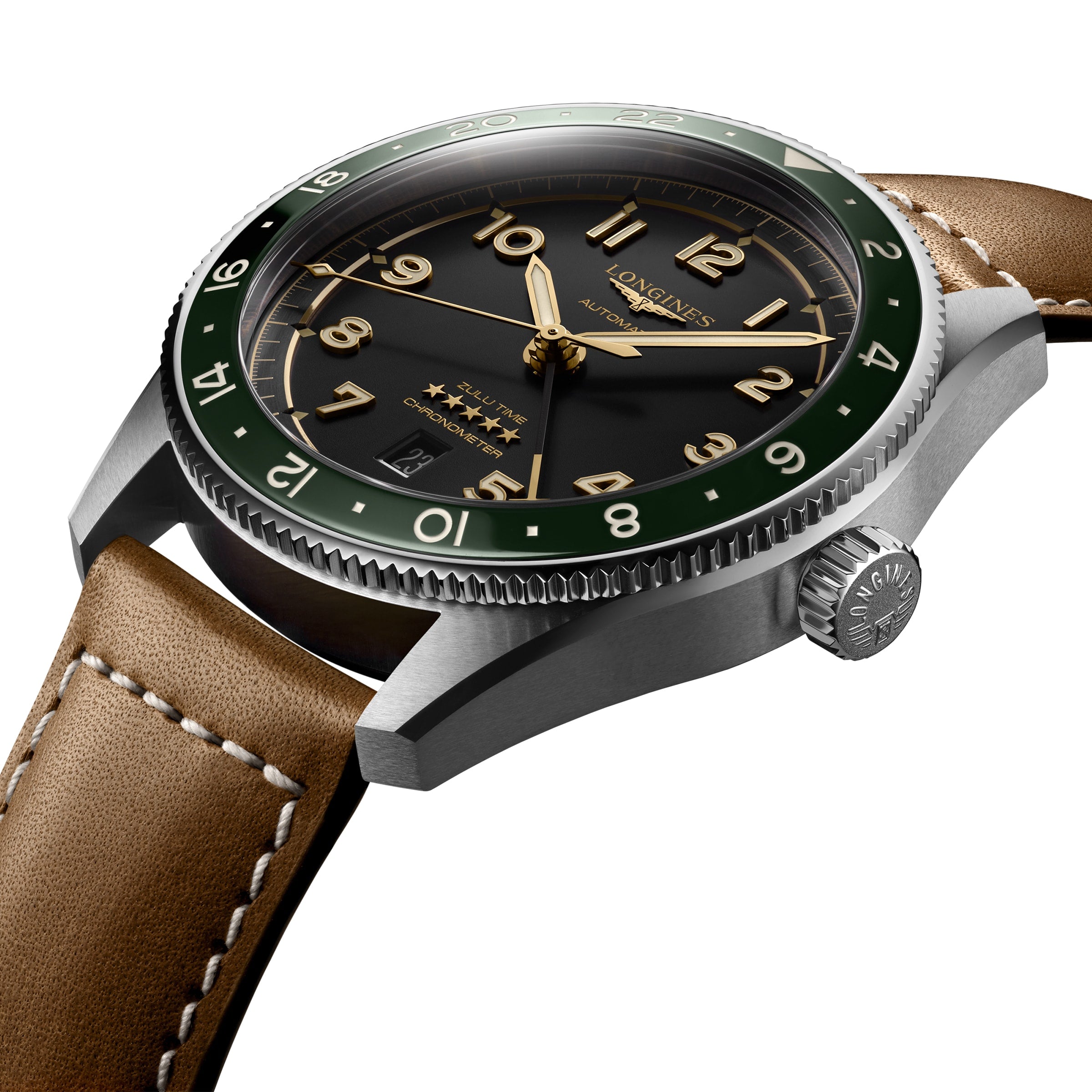 A close-up of a Longines Spirit Zulu Time wristwatch featuring a black dial, gold numerals, green bezel, brown leather strap, and polished stainless steel case.