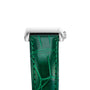 Close-up of a silver rectangular Longines DolceVita watch case with a green leather strap in crocodile pattern. The face is not shown, but this DolceVita model by Longines runs on a precise quartz movement.