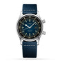 The Longines Legend Diver stainless steel watch features automatic movement, a blue dial, two crowns, a date display, and a textured blue strap, displayed against a white background.
