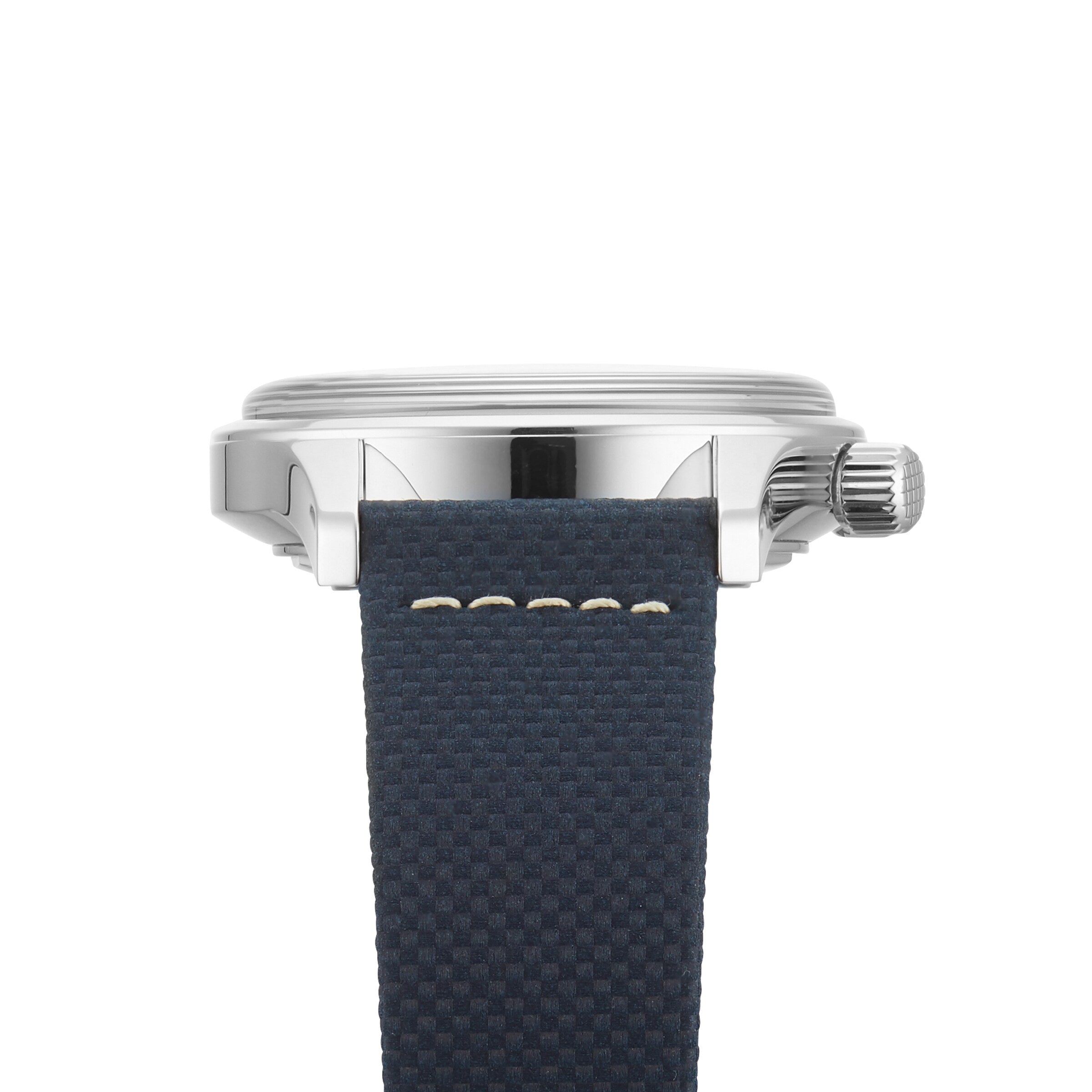 Side view of the Longines Legend Diver, featuring a silver case and a blue textured strap with white stitching.