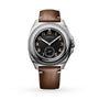 The Longines Pilot Majetek is a classic wristwatch with a brown leather strap and a black dial featuring gold numerals.