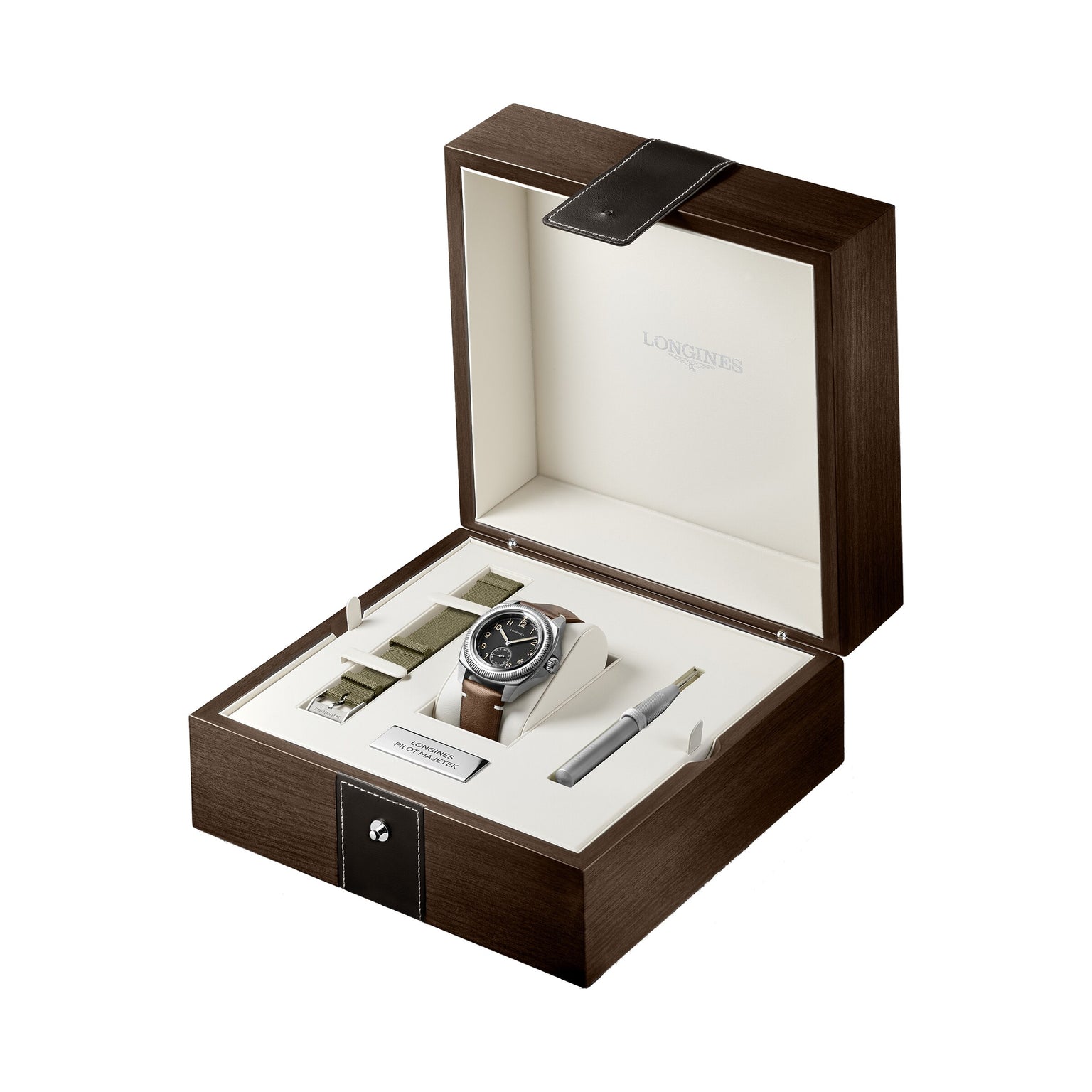 The Longines Pilot Majetek boxed set includes a luxury pilot watch, a brown strap, two extra green straps, a strap-changing tool, and a warranty card—all elegantly arranged in a wooden case celebrating aviation heritage.