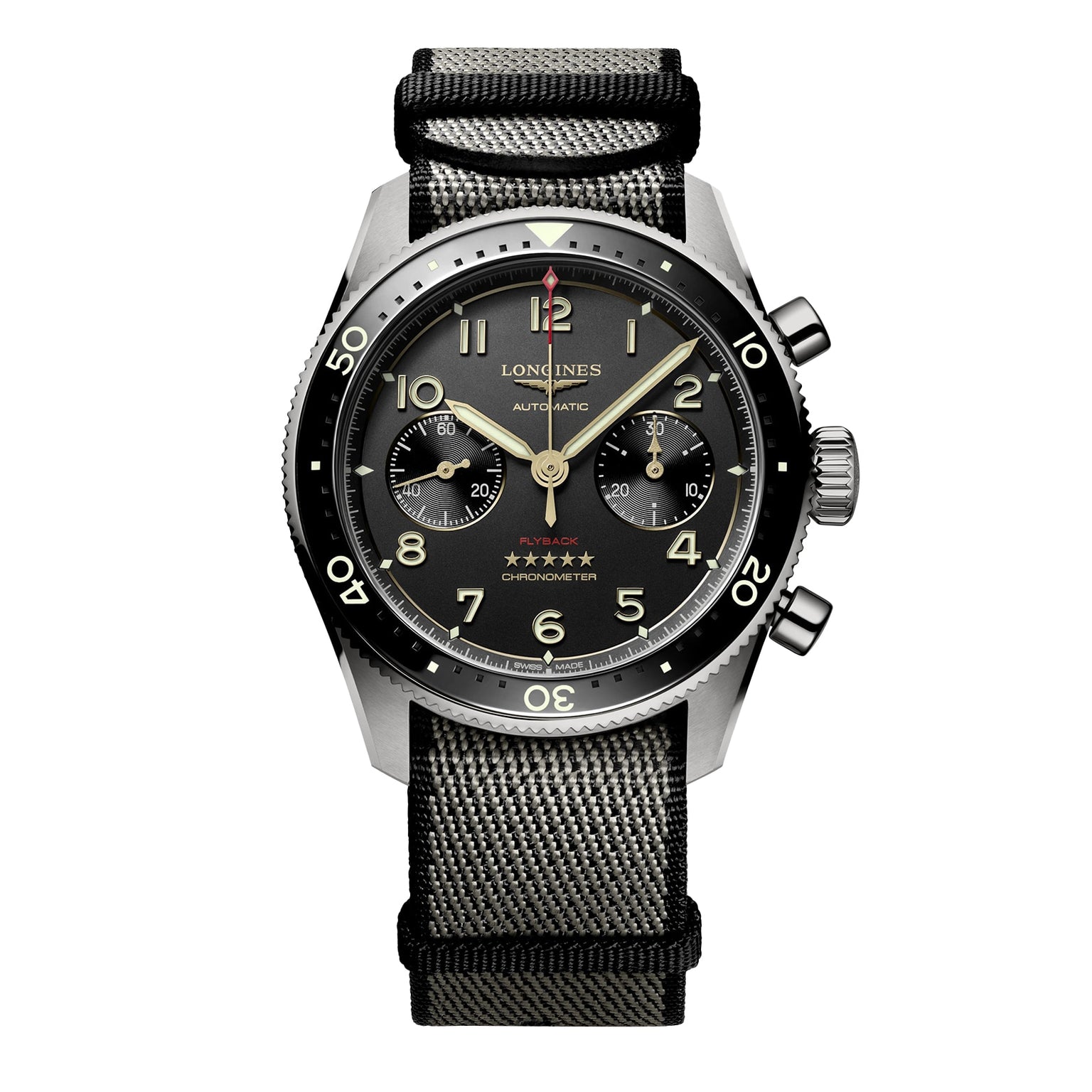 The Longines Spirit Flyback Titanium is a pilot watch with a titanium chronograph case, black dial with two subdials, black bezel, and a black and gray fabric strap.