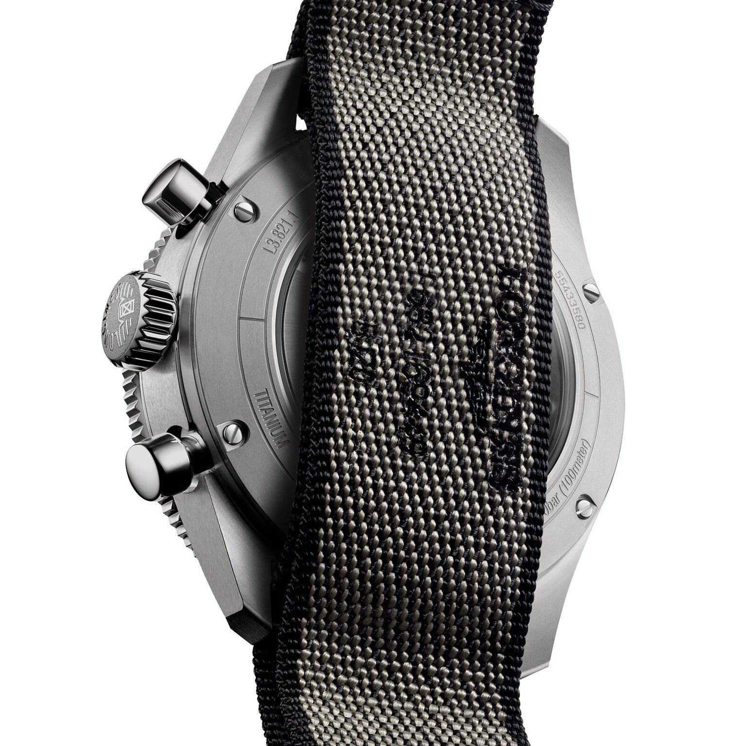 Close-up of the Longines Spirit Flyback Titanium watchs back, with its engraved metal case partially covered by a textured black strap.