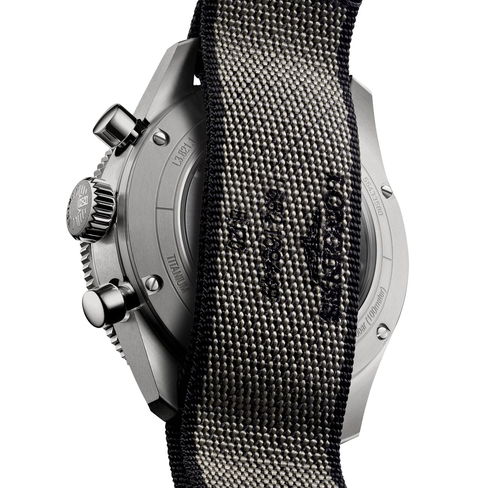 Close-up of the Longines Spirit Flyback Titanium watchs back, with its engraved metal case partially covered by a textured black strap.