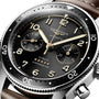 Close-up of the Longines Spirit Flyback, an automatic chronometer wristwatch with COSC certification, flyback function, black dial, gold numerals and hands, two subdials, and a stainless steel case.