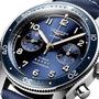 Close-up of the Longines Spirit Flyback, featuring a blue dial, gold hands, chronograph subdials, stainless steel case, rotating bezel, and displaying Flyback and Chronometer.