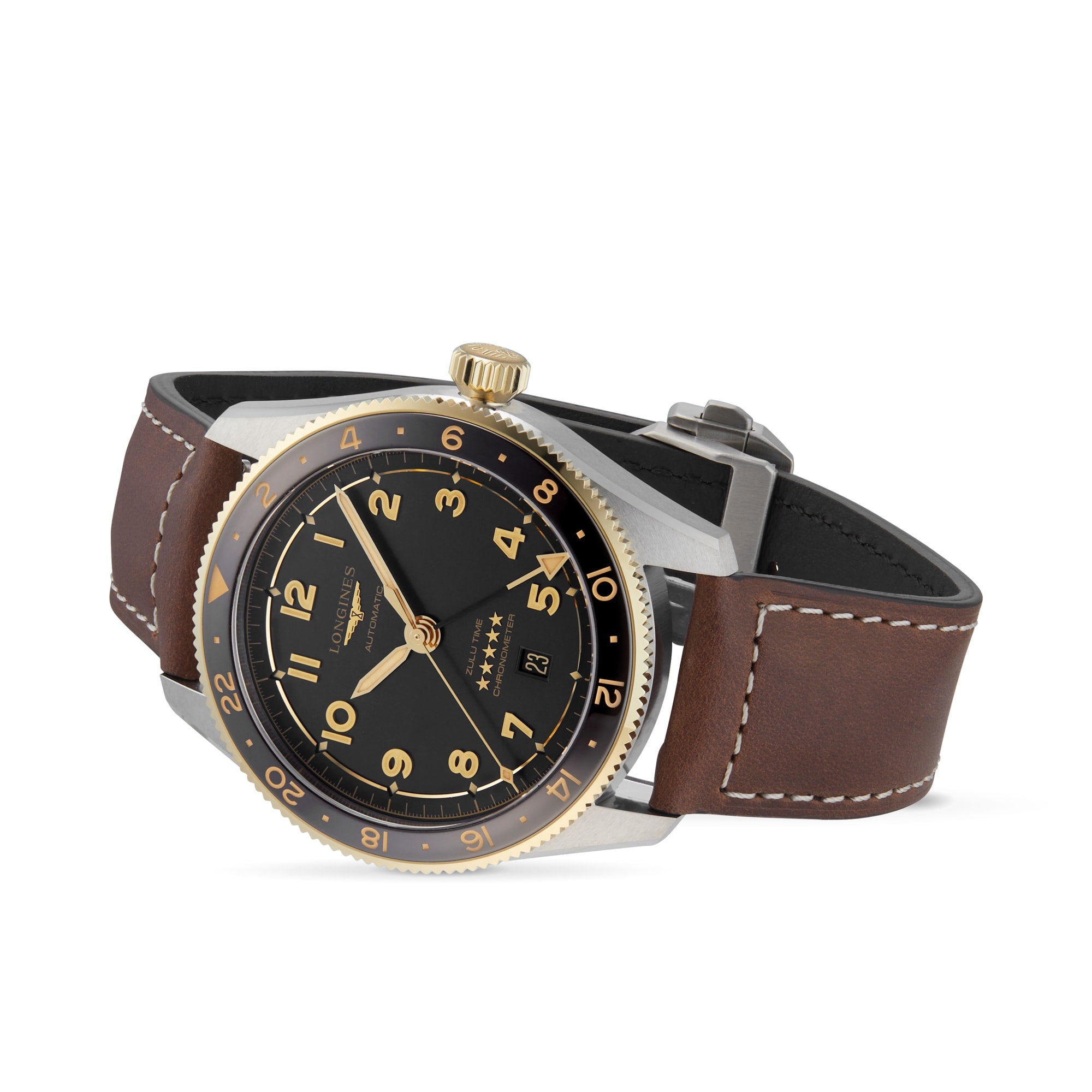 The Longines Spirit Zulu Time wristwatch features a black and gold dial, brown leather strap, gold crown, Arabic numerals, and date display. This chronometer-certified model is shown angled on a white background, evoking the spirit of exploration.