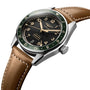 The Longines Spirit Zulu Time wristwatch boasts a stainless steel case, green bezel, black dial with gold accents, brown leather strap, and date window at 6—ideal for enthusiasts of precision and timeless style.
