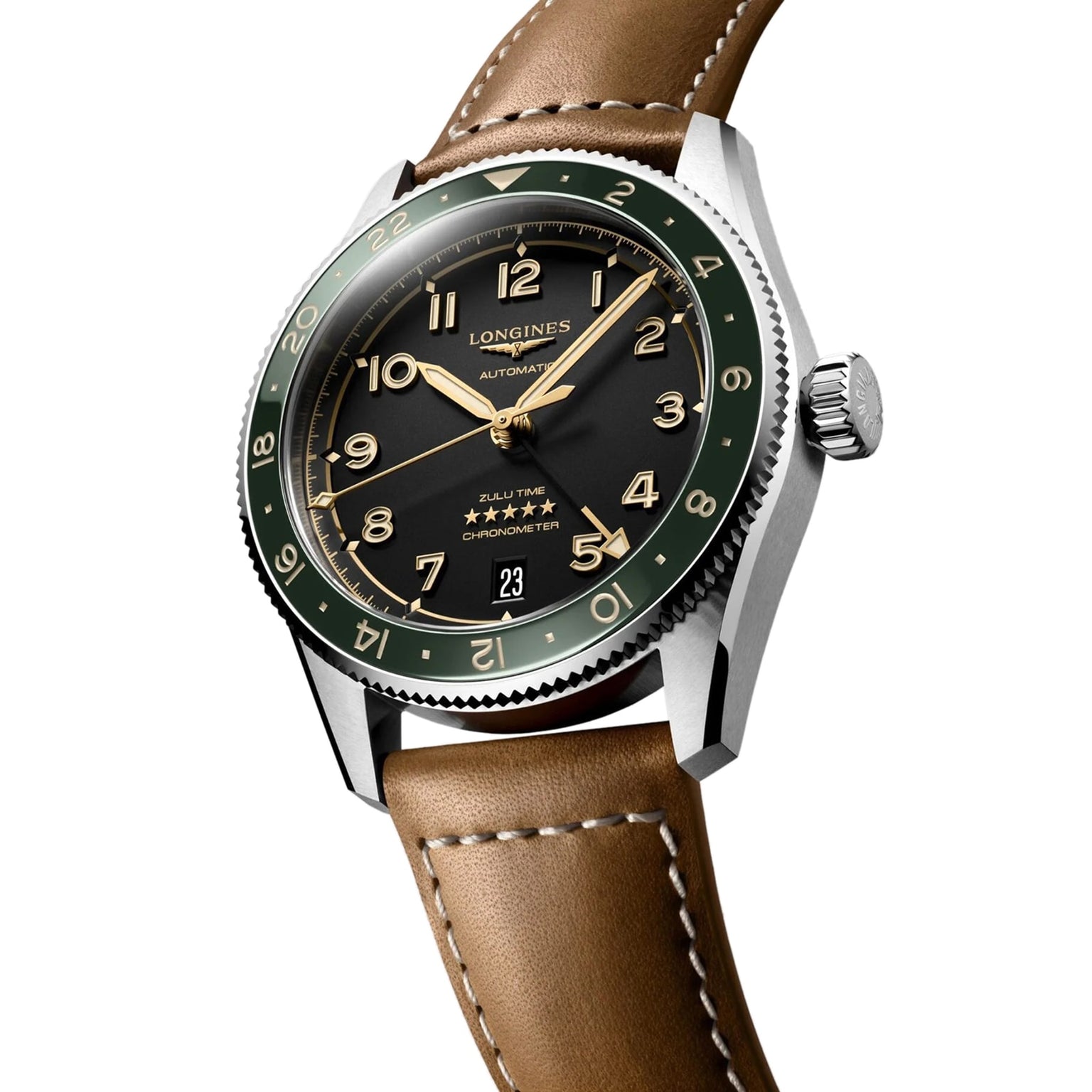 The Longines Spirit Zulu Time features a black dial, green bezel, brown leather strap, gold markers, stainless steel case, and a date display at 6 o’clock.