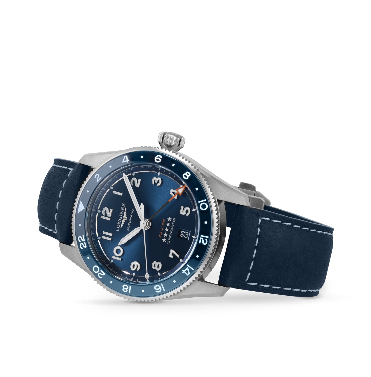 A Longines Spirit Zulu Time wristwatch with a blue dial, white numerals, date at 3 o’clock, stainless steel case, blue bezel, and blue leather strap with white stitching is shown against a white background.