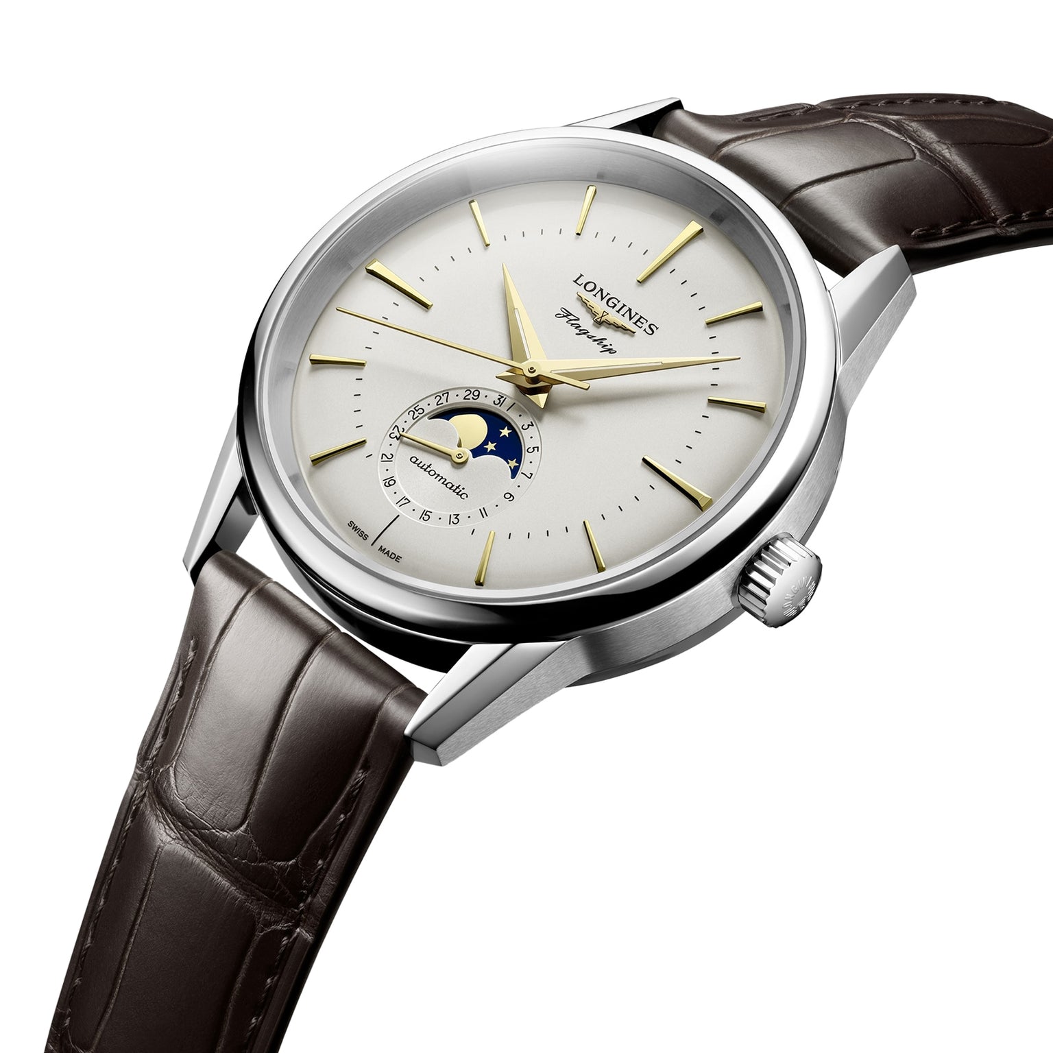The Longines Flagship Heritage Moonphase features a silver case, white dial, gold hands, date pointer, moon phase display, and brown leather strap—embodying innovative spirit with timeless design.