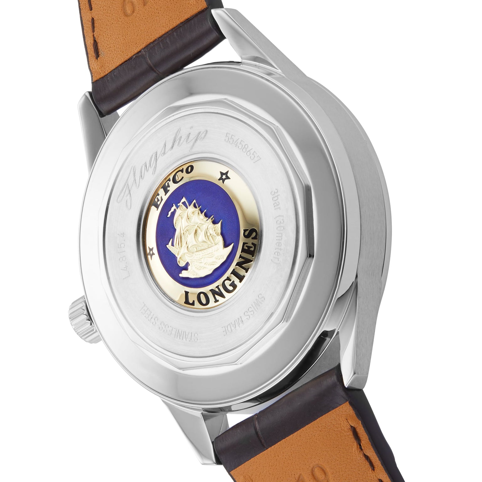 The Flagship Heritage Moonphase by Longines features a gold and blue ship emblem, engraved text on the back, and a brown leather strap, capturing the brand’s innovative spirit.