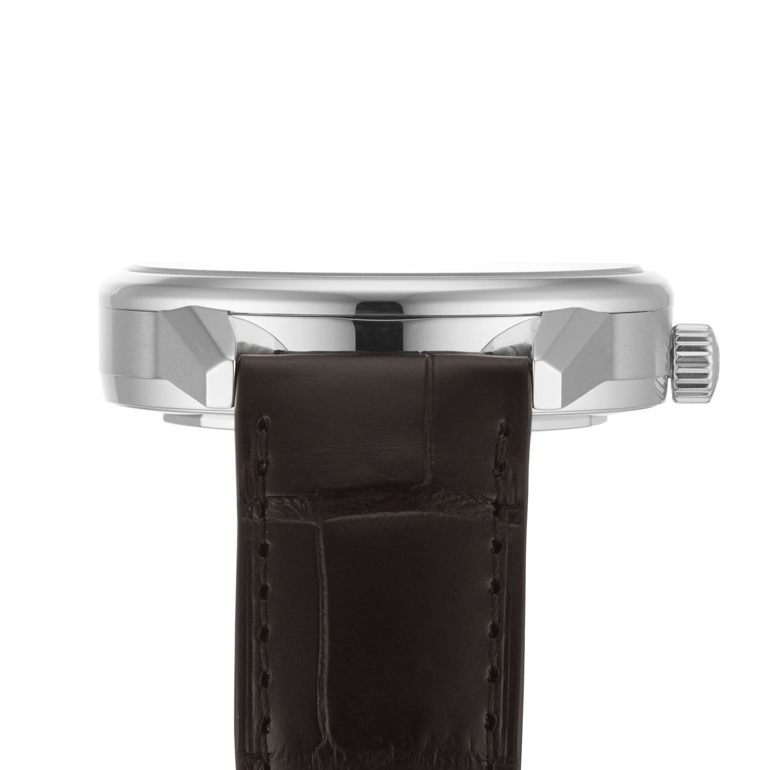 Side view of a silver Longines Flagship Heritage Moonphase case with crown, paired with a dark brown leather strap.