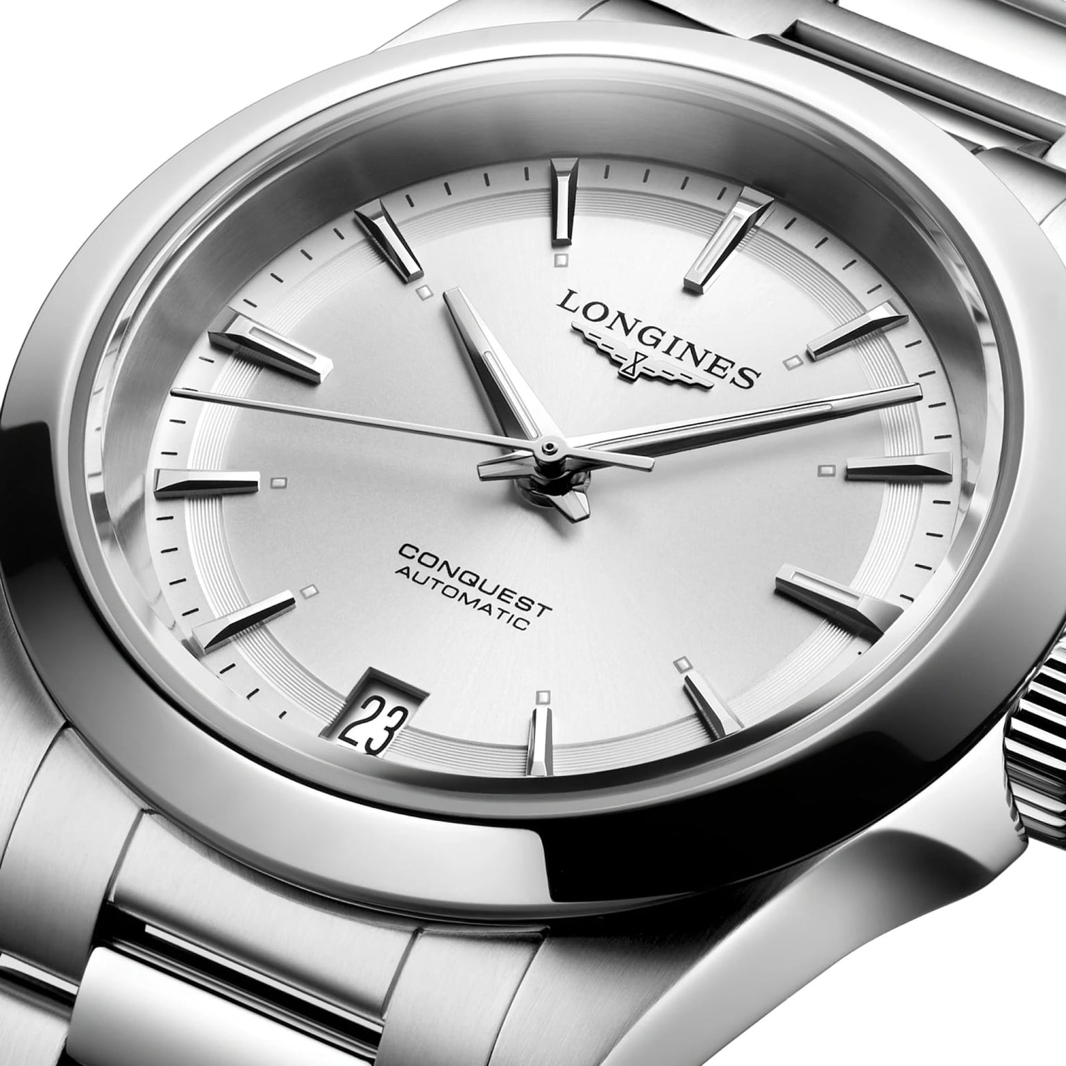 Close-up of the Longines Conquest wristwatch with a stainless steel case, silver dial, metal bracelet, and date display at 6 oclock.