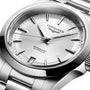 Close-up of the Longines Conquest wristwatch with a stainless steel case, silver dial, metal bracelet, and date display at 6 oclock.