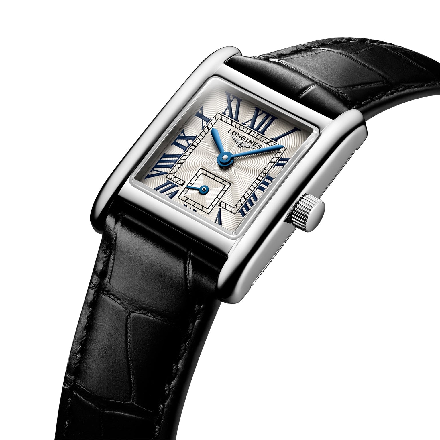 The Longines Mini DolceVita features a rectangular stainless steel case, black leather strap, white patterned dial with blue Roman numerals and hands, sapphire crystal, and is displayed angled on a white background.