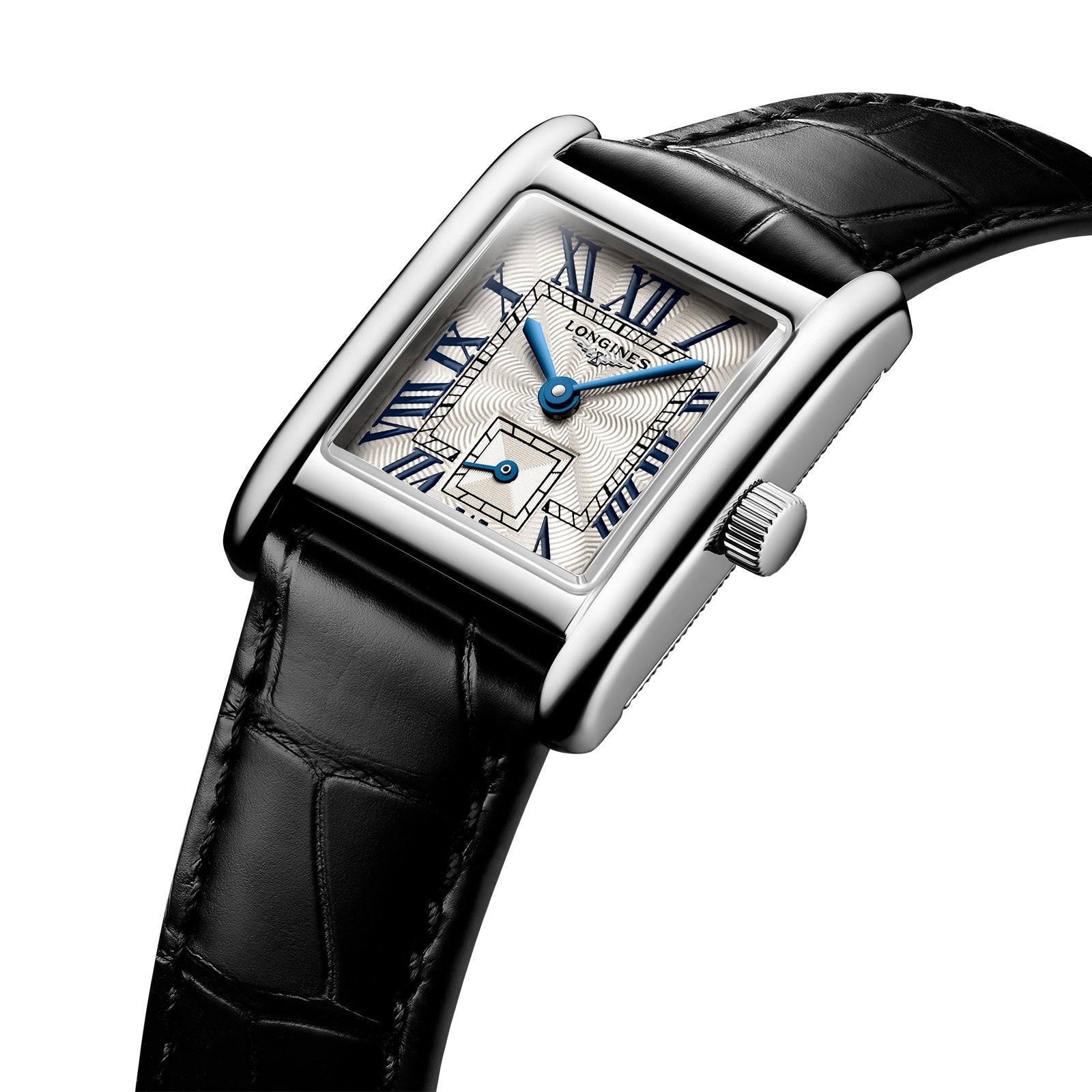 The Longines Mini DolceVita features a rectangular stainless steel case, black leather strap, white patterned dial with blue Roman numerals and hands, sapphire crystal, and is displayed angled on a white background.