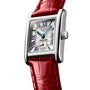 The Longines Mini DolceVita is a rectangular silver wristwatch featuring a white dial, blue hands, Roman numerals, and a red leather strap from the renowned Swiss brand.