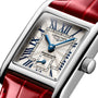 Close-up of a rectangular Longines Mini DolceVita wristwatch featuring blue hands, Roman numerals, a silver dial, and a red leather strap—an elegant timepiece from the renowned Swiss brand.