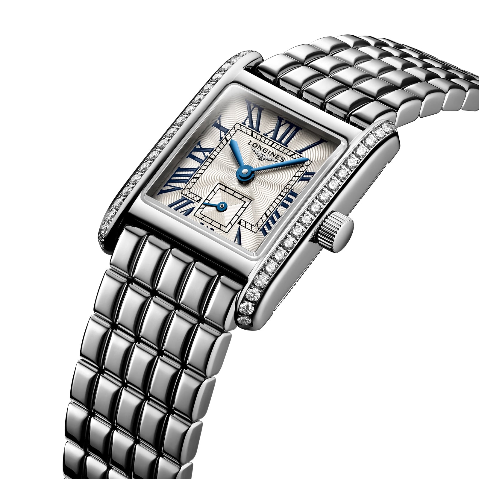 The Longines Mini DolceVita features a rectangular stainless steel case, metal link band, blue Roman numerals and hands, a small seconds dial, and a bezel adorned with Top Wesselton diamonds.