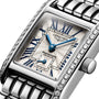 Close-up of the Longines Mini DolceVita wristwatch with a stainless steel case, rectangular dial, blue hands, Roman numerals, Top Wesselton diamond-set bezel, and a metal link bracelet.