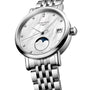The Longines Elegant Collection Moonphase is a silver wristwatch with a white dial, diamond indexes, date display, moon phase subdial, quartz movement, and a metal link bracelet.