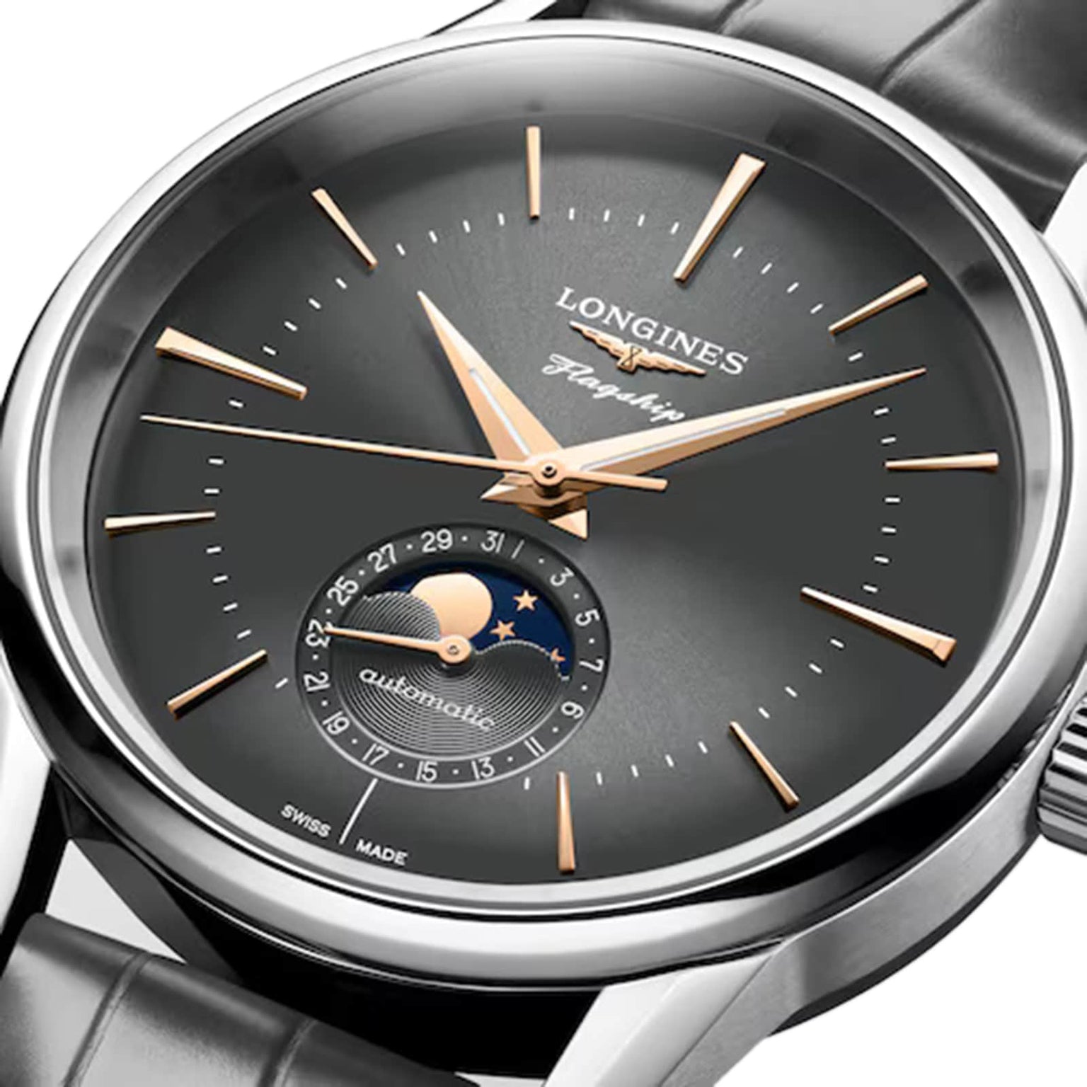 Close-up of the Longines Flagship Heritage Moonphase, showcasing a black dial with gold hour markers and hands, a moon phase subdial, and a black leather strap.