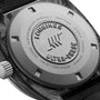 Close-up of the back of a Longines Ultra-Chron Carbon watch, displaying engraved branding, certification details, and a textured black strap—highlighting its advanced high-frequency movement and professional diving features.