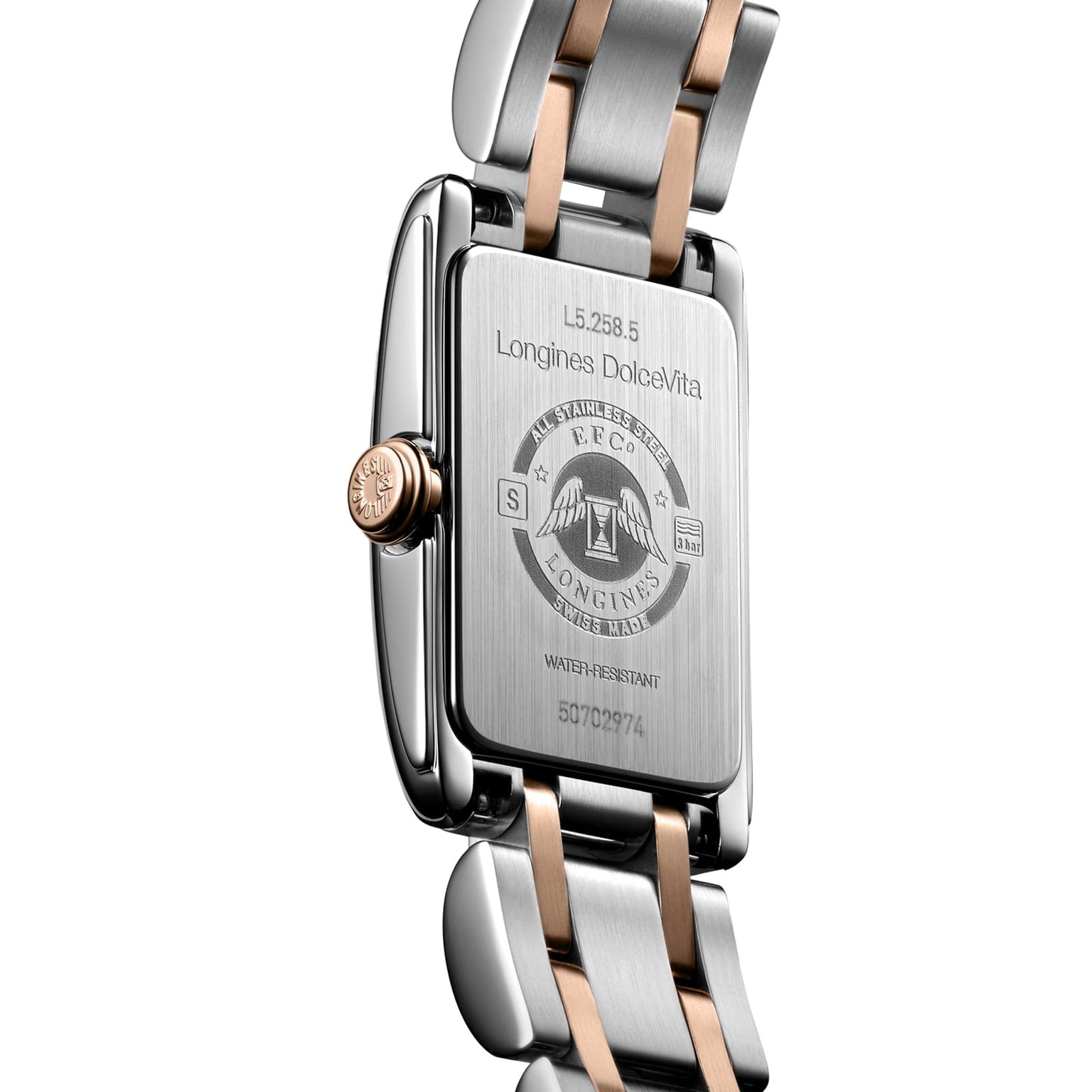 Back of a Longines Dolcevite watch featuring detailed engravings and a stylish two-tone metal bracelet.