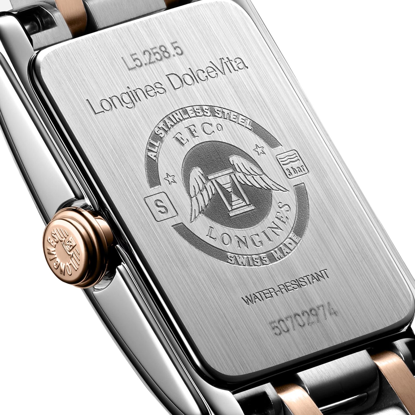 Close-up of the back of a Longines Dolcevite watch, highlighting engraved details and the Longines logo.